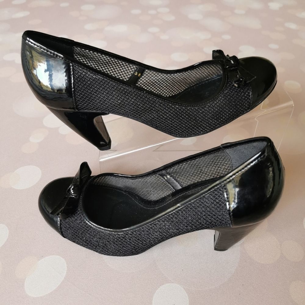 Brazilian-made Round-toe black vinyl pumps…